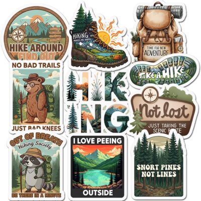 Ten hiking stickers with pine forests, mountains and a backpack, including a bear reading Just Bad Knees and a raccoon in an Out Of Breath Hiking Society badge